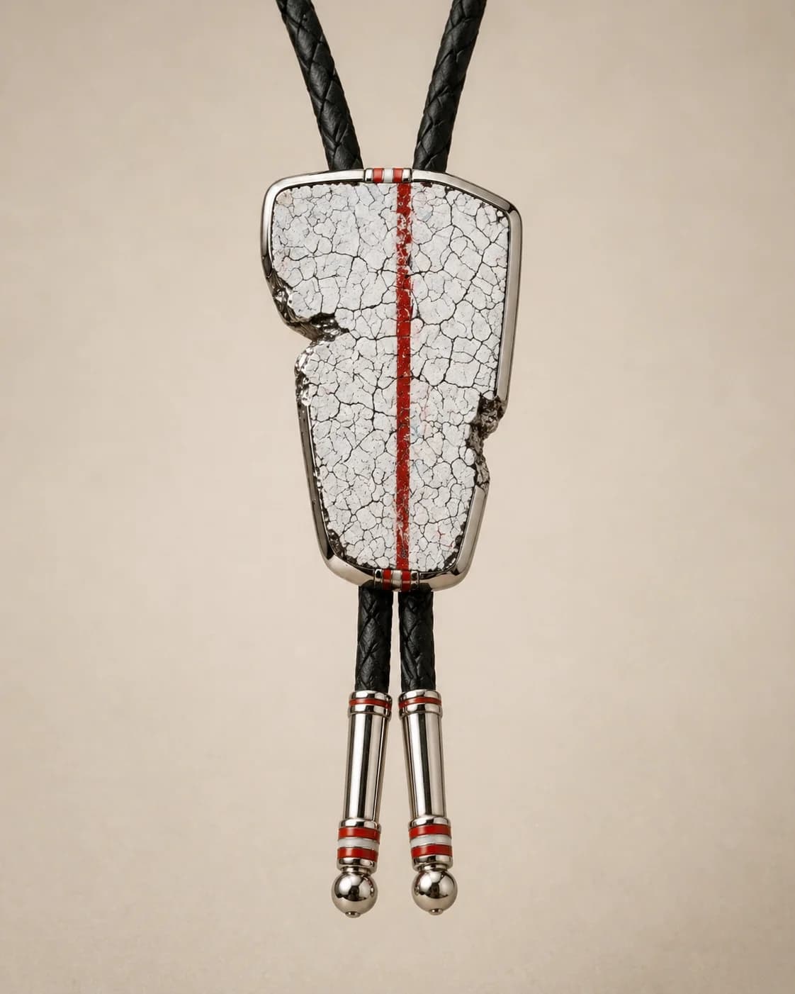 Bolo tie with a cracked white stone face